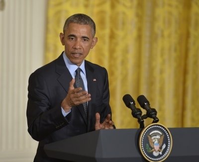 Obama Calls For End To Voter Suppression