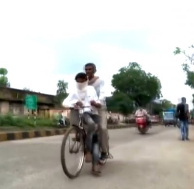 Man Cycles Over 100 Km To Take Son To Exam Centre